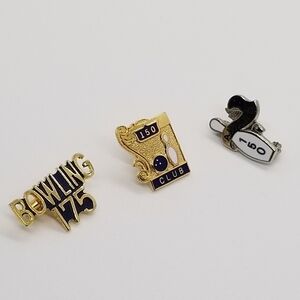 trio of bowling accomplishment pins
